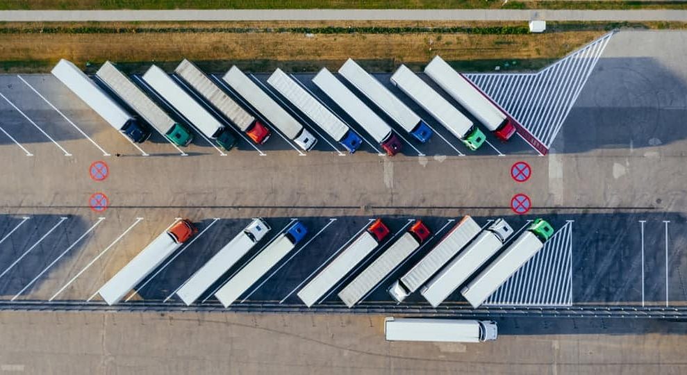 Line of parked up trucks — Whybirds Transport in Raceview, QLD